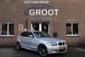 BMW 1-serie - 116I HIGH EXECUTIVE M-PAKKET/NAVI/CRUISE/CLIMA - 1 - Thumbnail