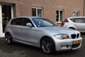 BMW 1-serie - 116I HIGH EXECUTIVE M-PAKKET/NAVI/CRUISE/CLIMA - 1 - Thumbnail