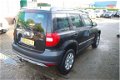 Skoda Yeti - 1.2 TSI Active Plus hoge instap, stoere MPV met trekhaak - 1 - Thumbnail