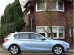 BMW 1-serie - 116i 136PK+ automaat High Ex. 2013 LED + I-drive - 1 - Thumbnail