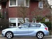 BMW 1-serie - 116i 136PK+ automaat High Ex. 2013 LED + I-drive - 1 - Thumbnail