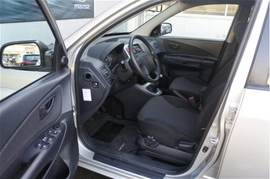 Hyundai Tucson - 2.0i Dynamic Executive | Airco | Parkeersensoren | Cruise control | Radio/CD - 1