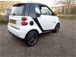 Smart Fortwo coupé - 1.0 PURE / AUTOMAAT / AIRCO / ELEK RMN / C.VERGR.AFSTAND / 15 INCH LM VLG / RAD - 1 - Thumbnail