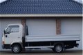 Nissan Cabstar E - 75.28-290 2.3D 3 Zits, PickUp, Laadbak 3.65 m, Trekhaak - 1 - Thumbnail