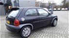 Opel Corsa - 1.0i-12V Strada Zwart - 1 - Thumbnail