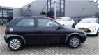 Opel Corsa - 1.0i-12V Strada Zwart - 1 - Thumbnail