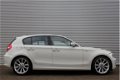 BMW 1-serie - 120i High Executive / XENON / STOELVERWARMING / PDC V+A / SPORT-PAKKET - 1 - Thumbnail