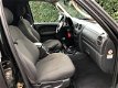 Jeep Cherokee - 2.5 CRD 143PK SPORT AC GRIJS KENTEKEN - 1 - Thumbnail