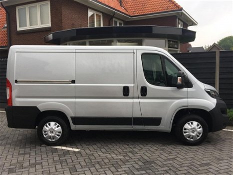 Peugeot Boxer - GB 330 L1H1 BlueHDi 130PK Premium Pack Airco, Cruise control, Camera, Voorraad Voord - 1