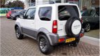 Suzuki Jimny - 1.3 EXCLUSIVE Leer | Airco | Lichtmetalen velgen - 1 - Thumbnail