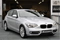 BMW 1-serie - 116i Sportline Autm Navi Xenon Schuifdak elektr / memory stoelen - 1 - Thumbnail