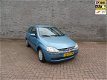 Opel Corsa - 1.0-12V Comfort - 1 - Thumbnail