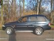 SsangYong Musso - 2.9 TDL hoog Airco grijs kenteken apk 08-2020 - 1 - Thumbnail