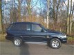 SsangYong Musso - 2.9 TDL hoog Airco grijs kenteken apk 08-2020 - 1 - Thumbnail