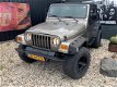 Jeep Wrangler - 4.0i AUTOMAAT *SMOKEGREY OUTLAW - 1 - Thumbnail