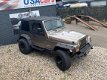 Jeep Wrangler - 4.0i AUTOMAAT *SMOKEGREY OUTLAW - 1 - Thumbnail