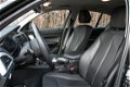 BMW 1-serie - 114i Upgrade Edition | 5drs. | navi | leer | xenon | trekhaak - 1 - Thumbnail