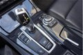 BMW 5-serie Touring - 520i High Executive Leer / automaat / panoramadak / navigatie / - 1 - Thumbnail