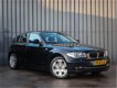 BMW 1-serie - 116i, 5 Drs, Business Line, PDC V+A, Xenon, Goed Onderhouden, Black-Edition - 1 - Thumbnail