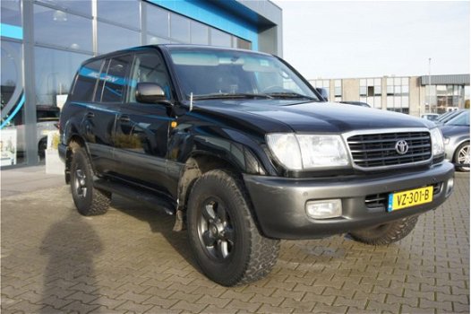 Toyota Land Cruiser 100 - 4.2 VX Standard Roof Window Van PDC, Navigatie & Airco - 1