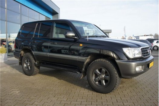 Toyota Land Cruiser 100 - 4.2 VX Standard Roof Window Van PDC, Navigatie & Airco - 1