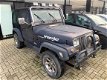 Jeep Wrangler - 2.5i Softtop ZONDAG ' s open van 12-tot 17 uur - 1 - Thumbnail