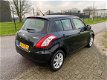 Suzuki Swift - 1.2 Comfort EASSS / Stoelverwarming / Airco / 5 deurs / Multifunctioneel stuurwiel - 1 - Thumbnail