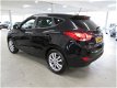 Hyundai ix35 - 2.0i i-Catcher Automaat - 1 - Thumbnail