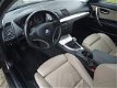 BMW 1-serie - 116i High Executive 5DRS LEER NAVI AIRCO NAP - 1 - Thumbnail