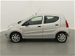 Suzuki Alto - 1.0 68PK Silver-Line (HALF-LEER/AIRCO/ELEK.RAMEN) - 1 - Thumbnail