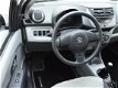 Suzuki Alto - 1.0 68PK Silver-Line (HALF-LEER/AIRCO/ELEK.RAMEN) - 1 - Thumbnail