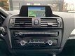 BMW 1-serie - 116i 2e eigenaar Xenon Navigatie Cruise - 1 - Thumbnail