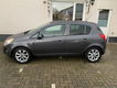 Opel Corsa - 1.4-16V Anniversary Edition / Airco/ Cruise Control/ Stuur+Stoelverwarming/ 5 Drs - 1 - Thumbnail