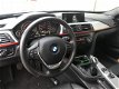 BMW 3-serie Touring - 320d High Executive Sport | Leer | Xenon | Pdc | Navi | Ecc | - 1 - Thumbnail