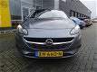 Opel Corsa - Favourite 1.4 90 pk - 5drs - navi - airco - lichtmetaal - parkeersensoren - zuinig en c - 1 - Thumbnail