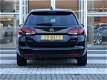 Opel Astra Sports Tourer - 1.4 Turbo 150pk Automaat Innovation | ECC | AGR | NAVI - 1 - Thumbnail