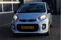 Kia Picanto - 1.0 CVVT EconomyLine (66pk) 5-drs/ Bumpers in kleur/ Deelbare achterbank/ Stuurbekr./ - 1 - Thumbnail