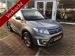 Suzuki Vitara - 1.6 Exclusive Navigatie, trekhaak, armsteun, achterspoiler, stootlijsten, 1e eigenaa - 1 - Thumbnail