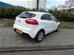 Kia Rio - 1.2 5 drs Plus Pack / Navigatie & 7jr. Garantie - 1 - Thumbnail