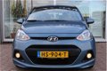 Hyundai i10 - 1.0i 66pk Blue Comfort + Tom Tom Rijklaar - 1 - Thumbnail