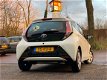 Toyota Aygo - 1.0 VVT-i x-nav 1e Eigenaar/Nw Apk/Cruise/Camera - 1 - Thumbnail