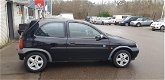 Opel Corsa - 1.2i-16V Strada 