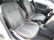 Opel Corsa - 1.4i 16V Enjoy 5 deurs + Airco - Cruisecontrol - 1 - Thumbnail