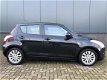 Suzuki Swift - 1.2 Exclusive EASSS Clima/keyless - 1 - Thumbnail