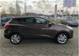 Hyundai ix35 - 2.0i i-Catcher *Navigatie, Trekhaak, Cruise Control, Clima, Camera - 1 - Thumbnail