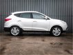 Hyundai ix35 - 2.0i 4WD, i-Catcher panoramadak, 100% Dealer Onderhouden, 1Ste Eigenaar, Leer, Navi, - 1 - Thumbnail