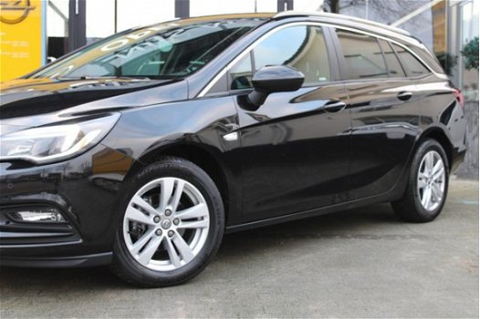 Opel Astra Sports Tourer - 1.4i Turbo Online Edition 150pk pdc / navi / trekh. / erg. comfort stoele - 1