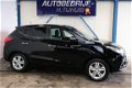 Hyundai ix35 - 2.0i Style Automaat - N.A.P. Airco, Cruise, Navi, PDC, Trekhaak - 1 - Thumbnail