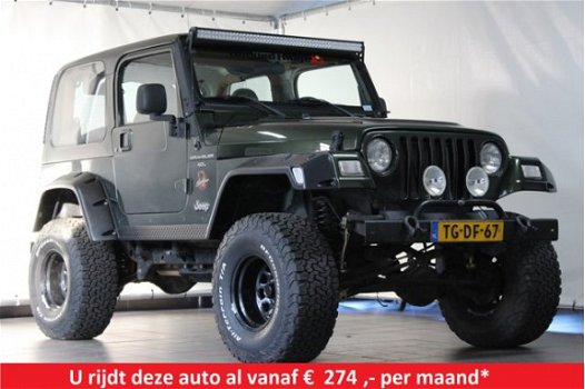 Jeep Wrangler - 4.0 I Sahara / LPG G3 / Youngtimer / Verhoogd - 1