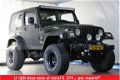 Jeep Wrangler - 4.0 I Sahara / LPG G3 / Youngtimer / Verhoogd - 1 - Thumbnail